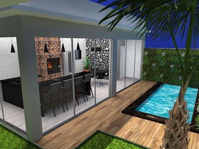 Cozinha externa com ilha e churrasqueira